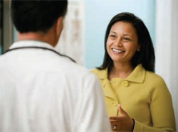 A woman speaking with her doctor