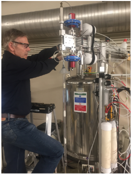 Adriaan Bax working with an NMR Spectrometer in his lab.