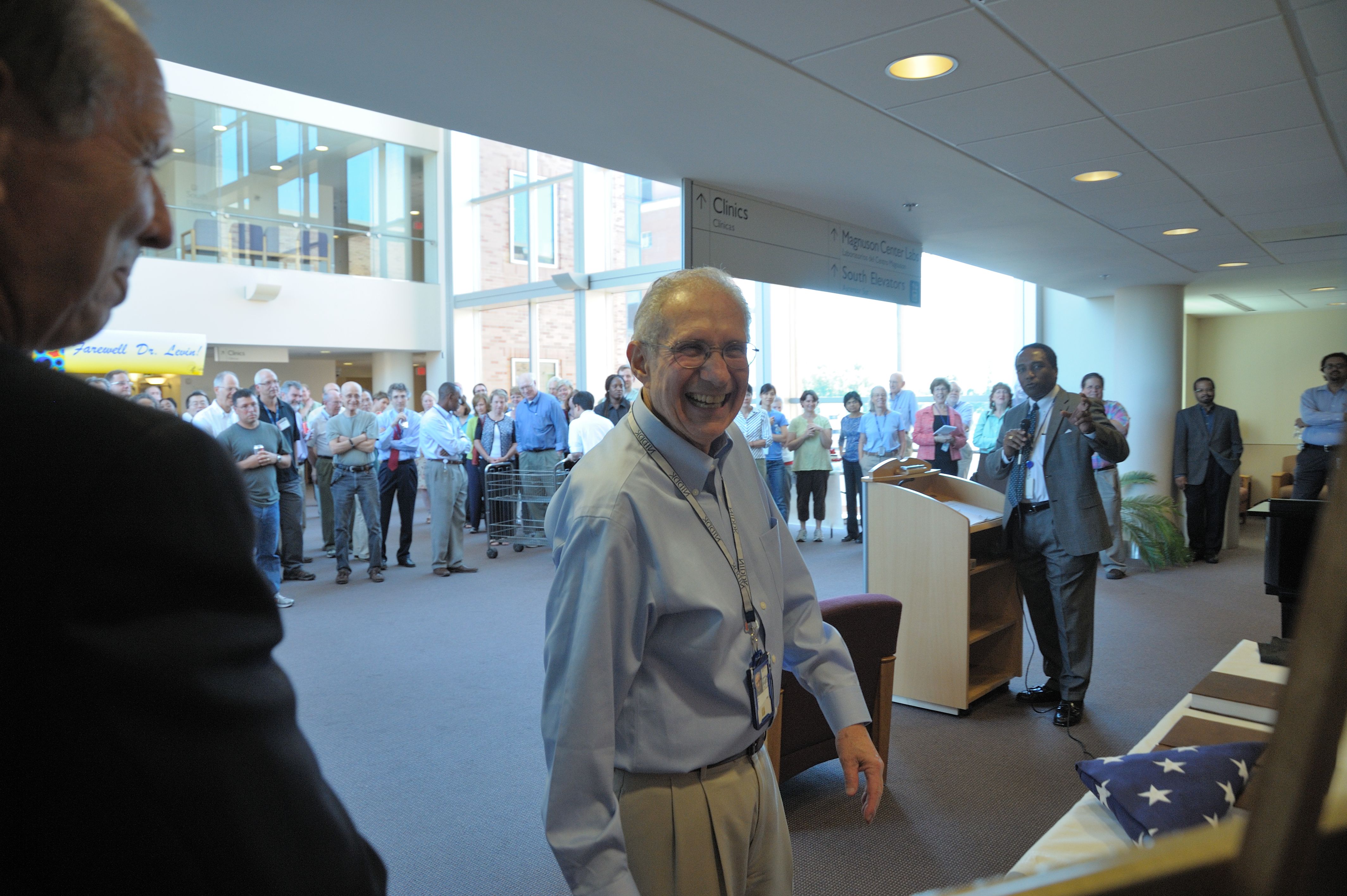 NIDDK Scientific Director Dr. Ira Levin (center) is honored by NIDDK Director Dr. Griffin P. Rodgers (at podium) at a celebration in honor of Levin's retirement after 48 years of government service.