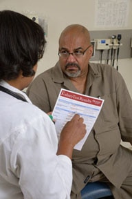 A patient speaks with his doctor about his kidney health