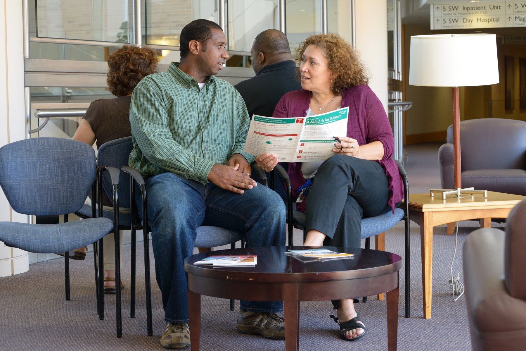 Patient discussing education material