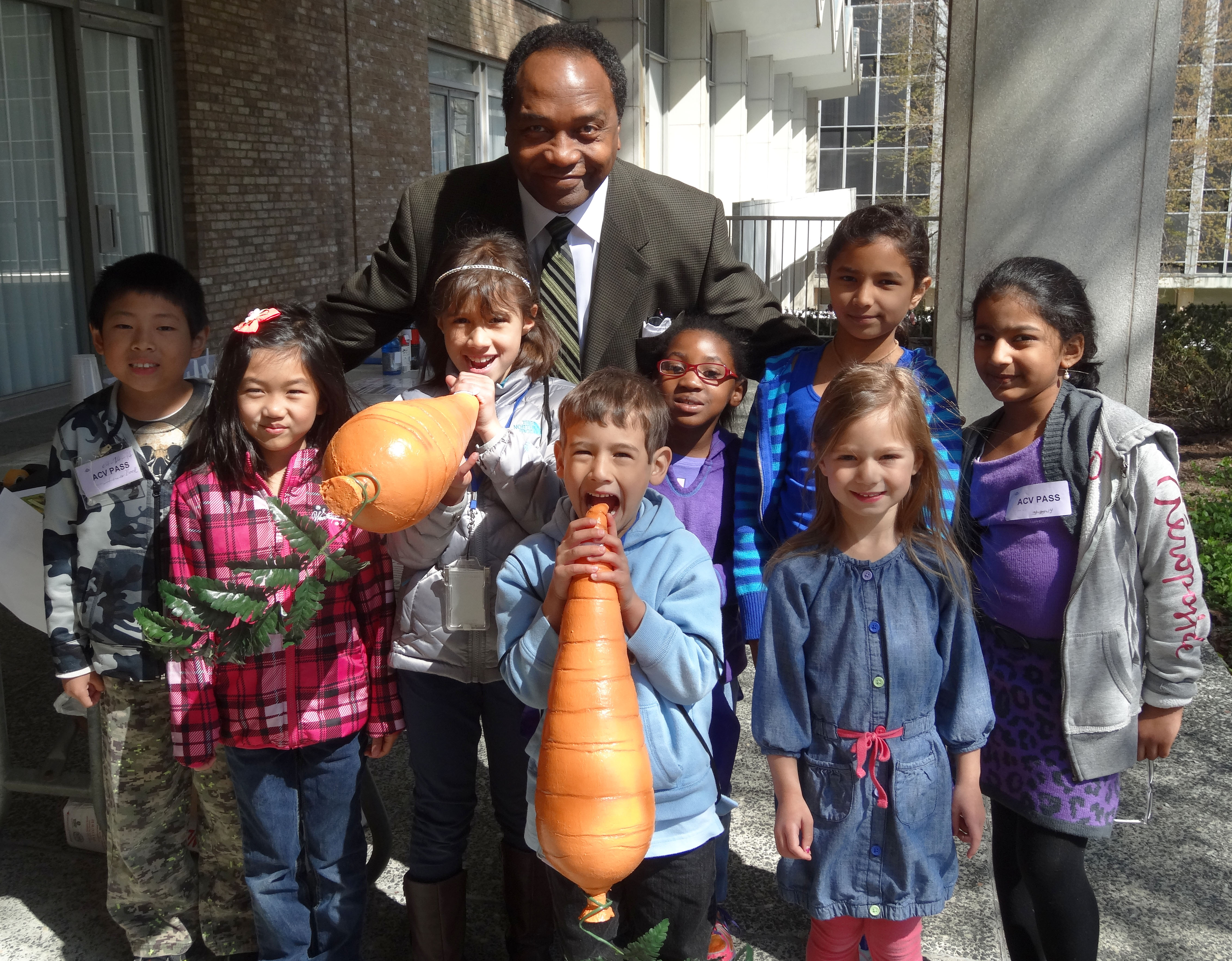 Photo of Griffin Rodgers with a group of children.