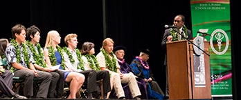 Photo of NIDDK Director Dr. Griffin P. Rodgers and the graduating class of the J.A. Burns School of Medicine