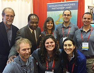 Photo of Dr. Phillip Smith, Dr. Griffin P. Rodgers, and staff from the Broad Institute of MIT and Harvard 