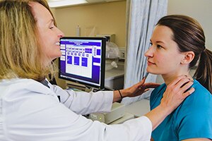 Photo of Female doctor with female patient