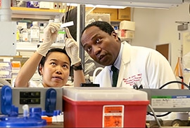 Photo of Dr. Rodgers plus lab member from b-roll developed for Sammies nomination