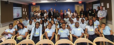 Group photo of Dr. Griffin P. Rodgers with staff and students from Kettering Elementary School in Prince George’s County that visited NIH’s campus on May 21 for a tour.
