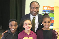 Photo of Dr. Griffin P. Rodgers with students from William B. Gibbs Elementary School in Germantown, Maryland.