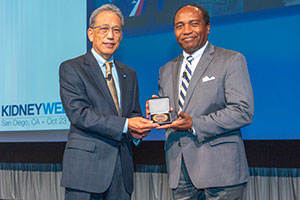 Photo of Dr. Rodgers receiving the President’s Medal from the American Society of Nephrology
