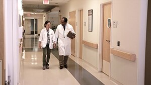Dr. Griffin P. Rodgers collaborates with a colleague at the NIH Clinical Center