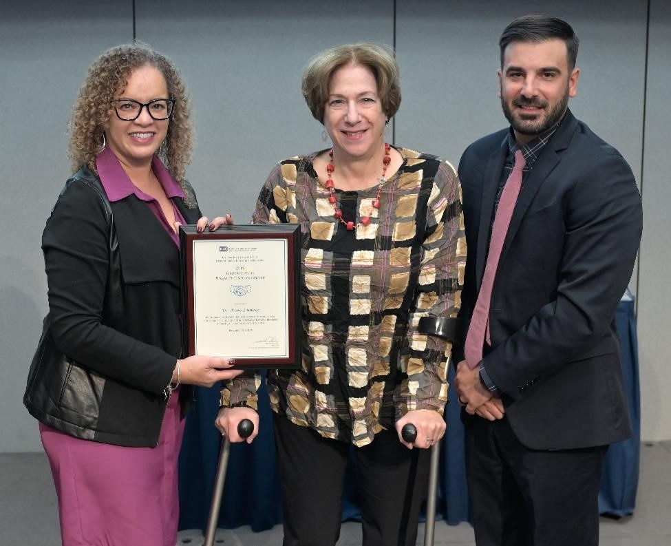 Dr. Anne Sumner receiving the EDI award.