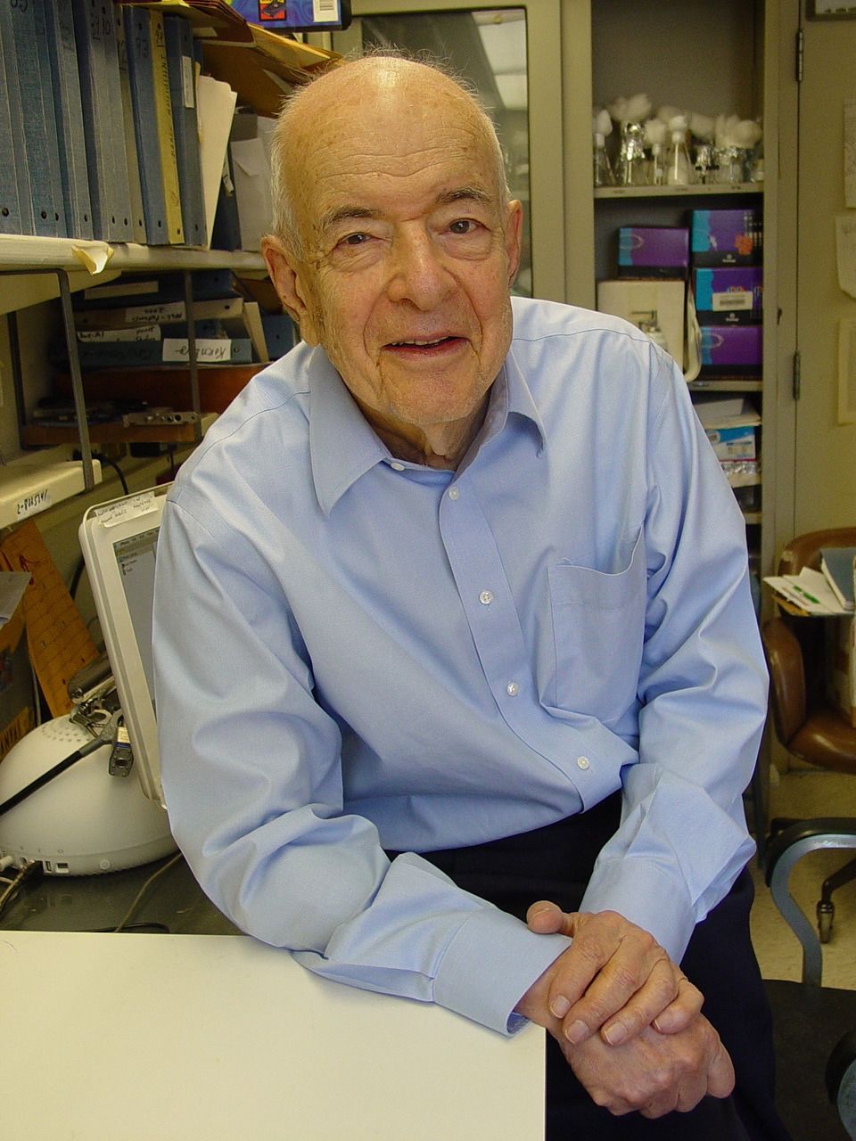 Dr. Herbert Tabor sitting in his office.