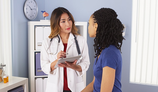 Doctor visiting with patient