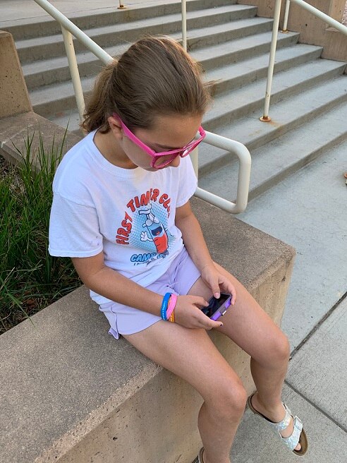 A child looking at the artificial pancreas device