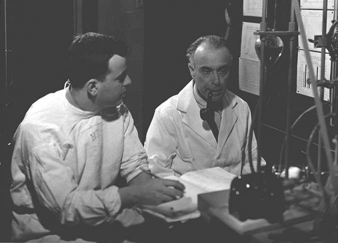 Herbert Tabor and Sanford Rosenthal in a lab in 1944