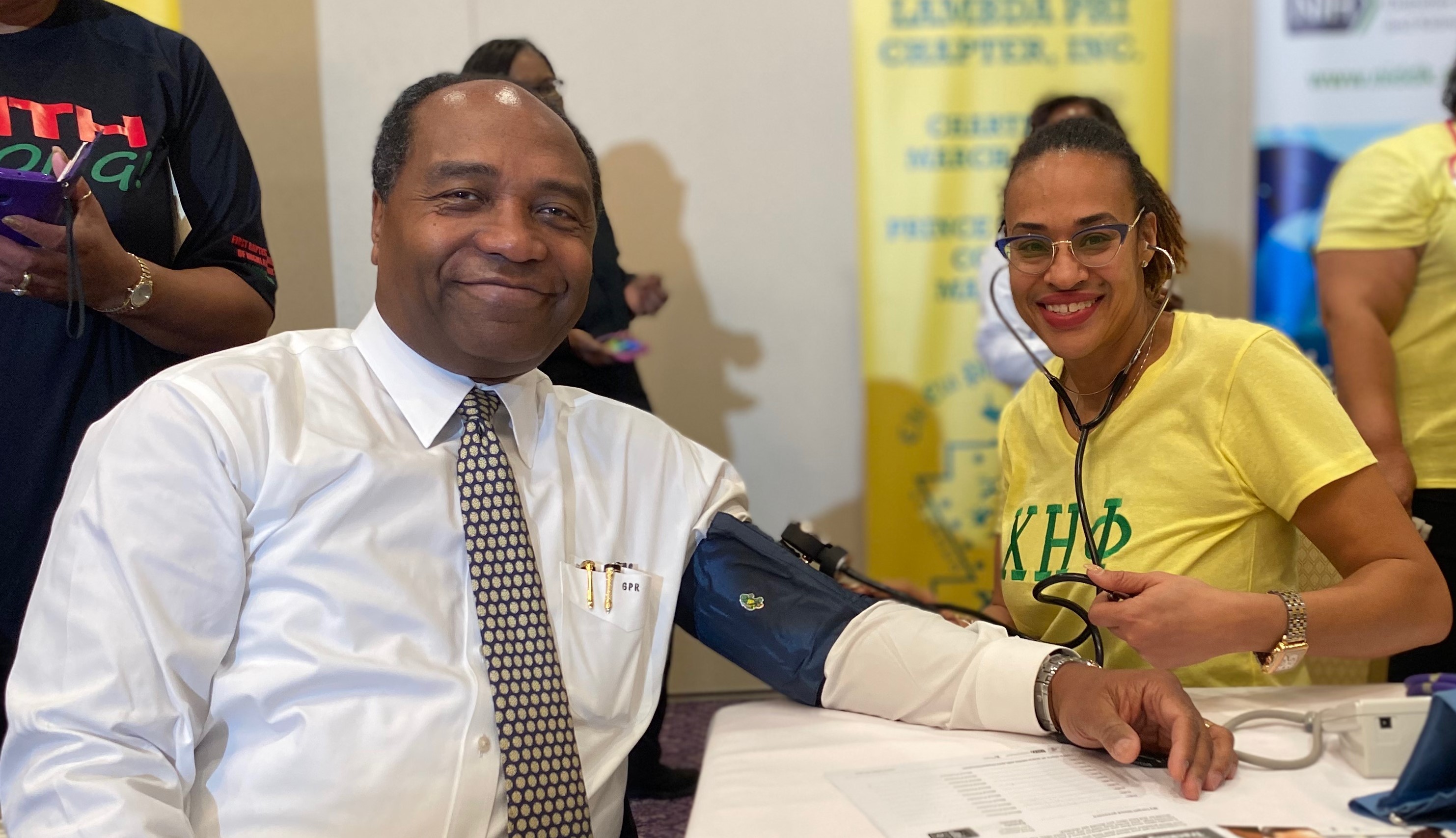 Dr. Rodgers getting his blood pressure taken