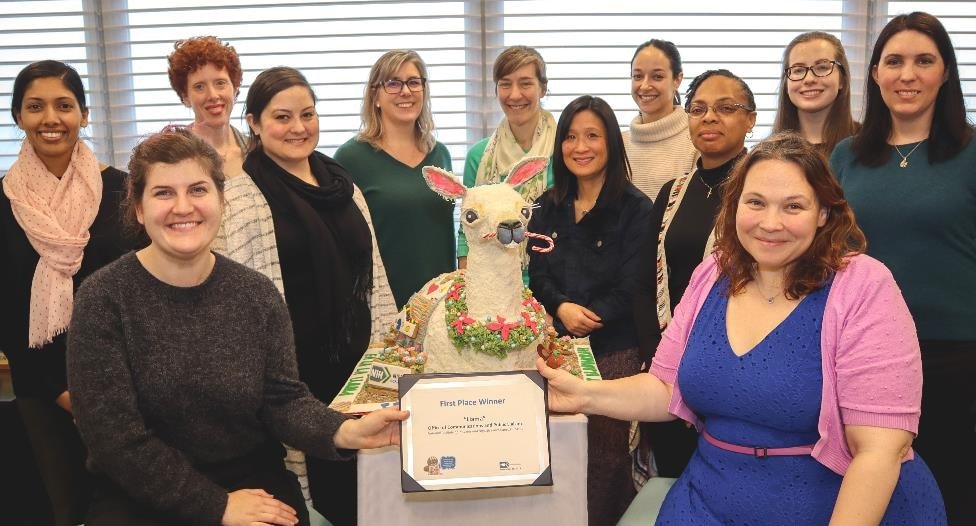 Group of NIDDK employees with a festive gingerbread llama