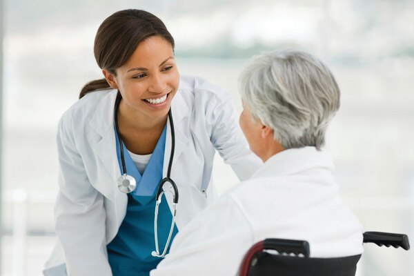 Doctor with patient in wheelchair