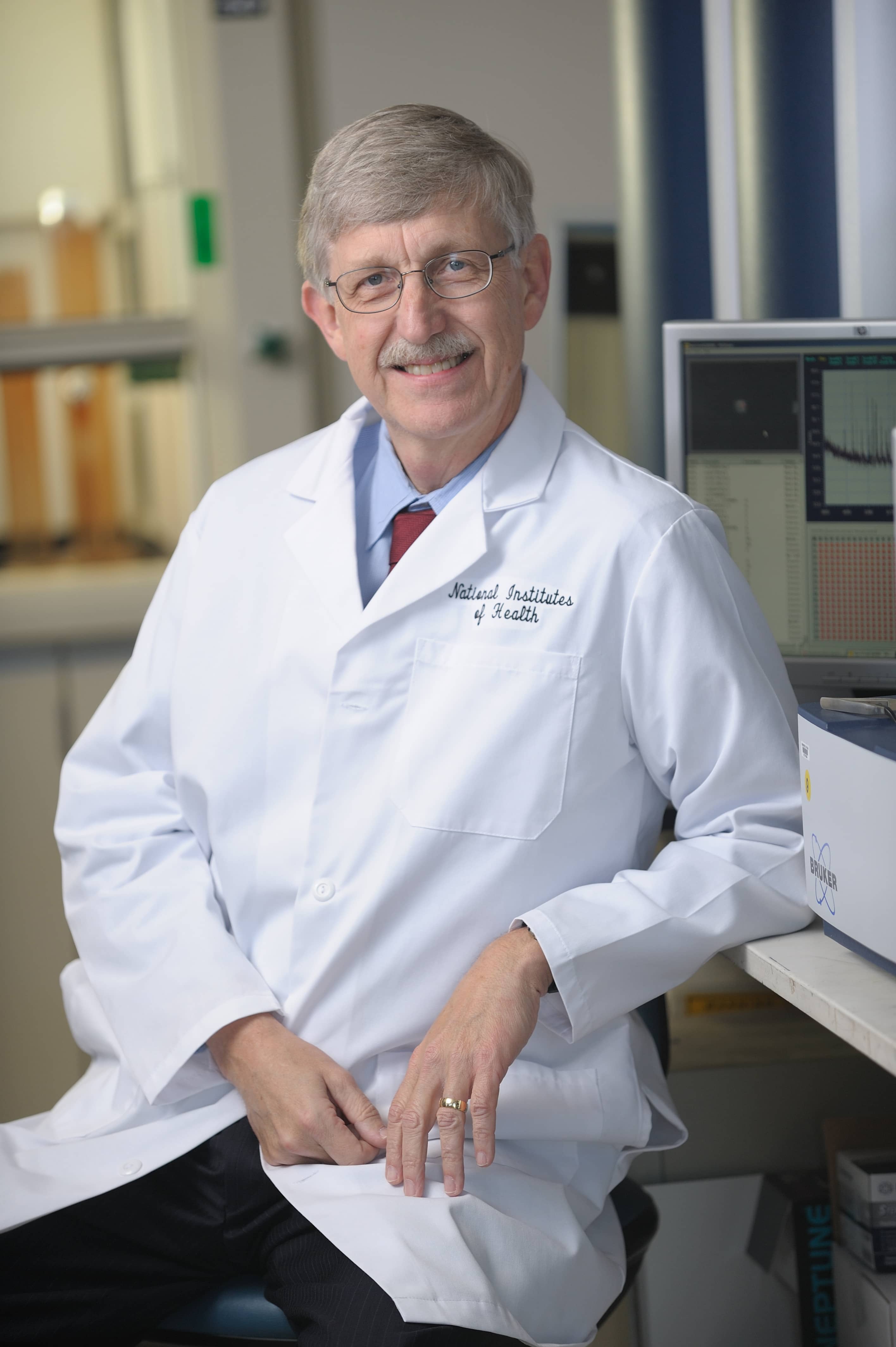 Dr. Francis Collins in his lab coat.