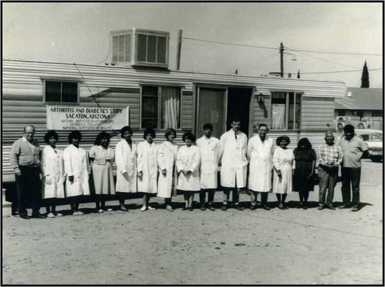 Study staff outside trailer