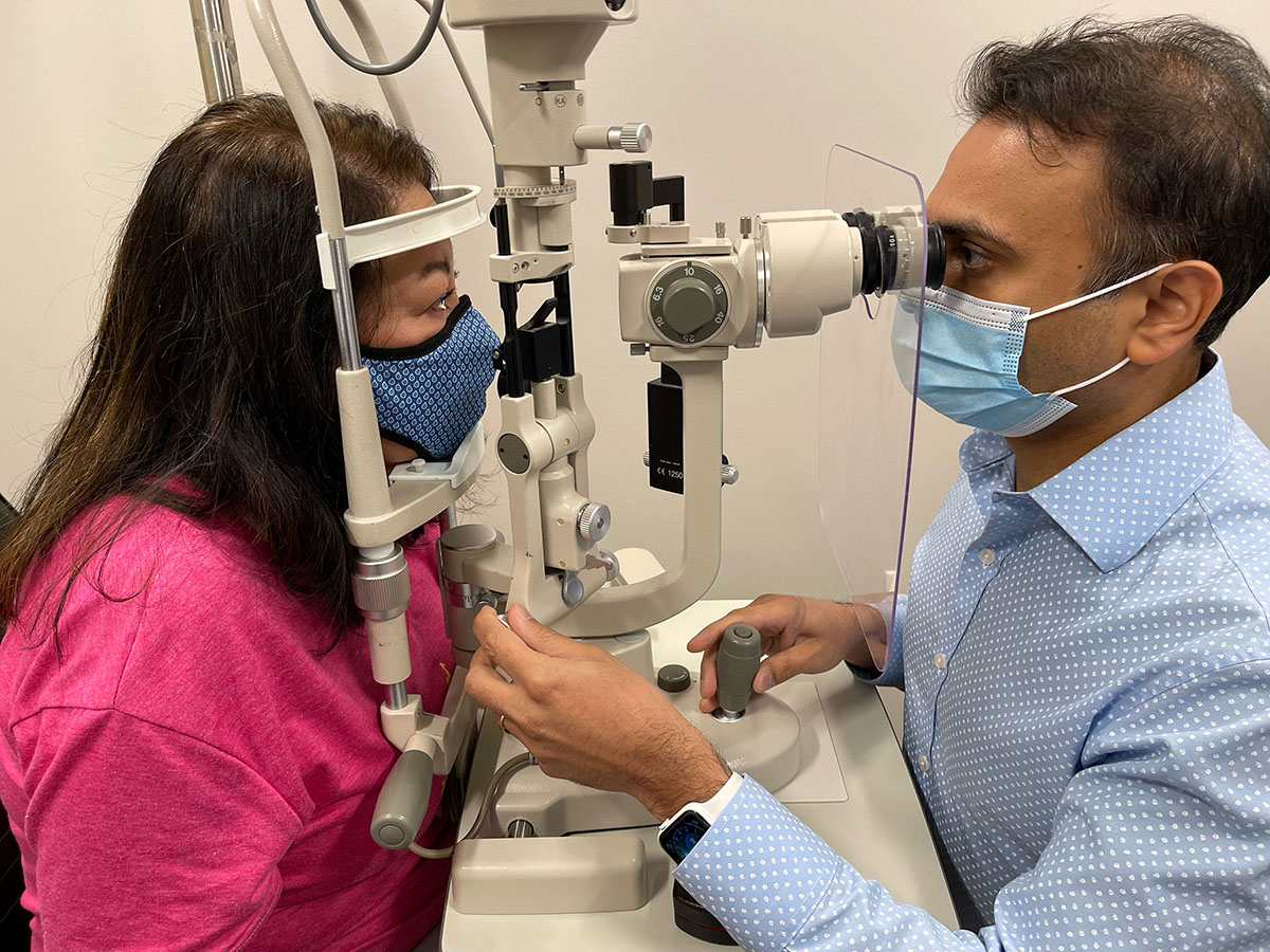 A doctor performing an eye exam