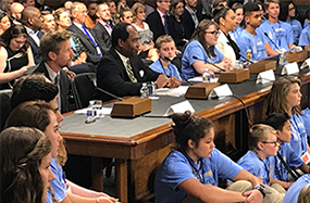 Photo of speakers discussing the burden of type 1 diabetes and the effect of research progress during a hearing held by the Senate Special Committee on Aging