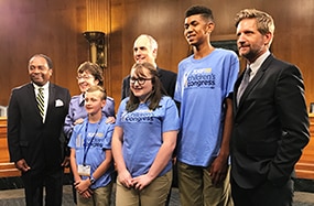 Photo of a group of speakers from the progress for type 1 diabetes research event meet with leadership from the Senate Special Committee on Aging