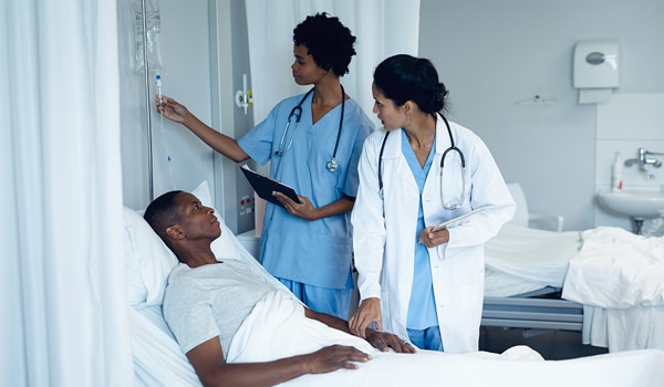 Two doctors with a patient at the hospital