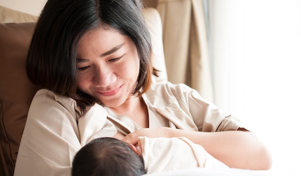 Mother breastfeeding her child