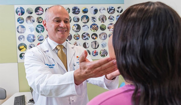 Dr. Thomas Inge, lead researcher for an NIH-funded study of bariatric surgery in teens, sees a patient at Children’s Hospital Colorado in Denver.