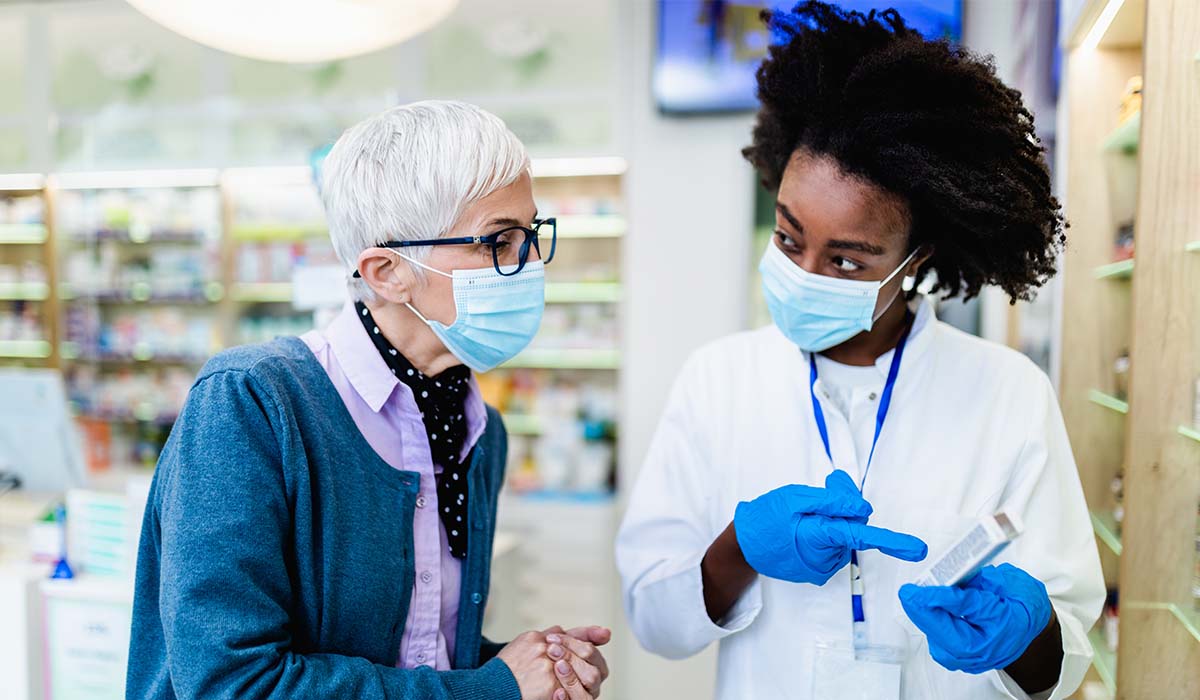 A health care professional speaking with a patient.