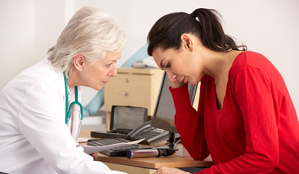 A doctor talking to a patient