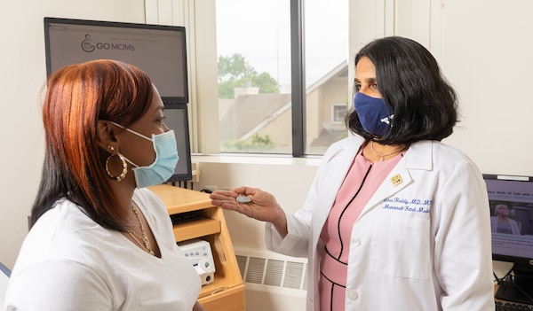 A doctor speaking with a patient.