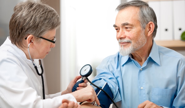 Doctor taking a patient's blood pressure