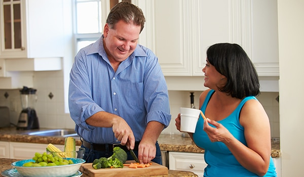 A couple cooking.