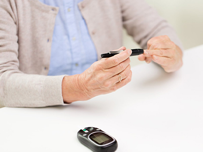 A person testing their blood glucose.