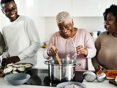 A family enjoying cooking together.