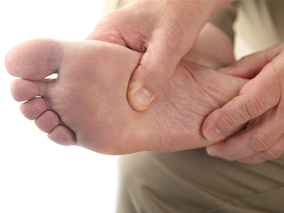 A person checking their feet.