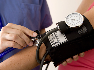 Patient getting their blood pressure taken.