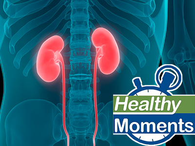 List of kidney disorders on a sheet of paper overlaid with a silver pen and stethoscope