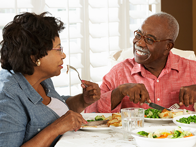 African American couple eating a home-cooked meal
