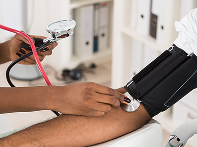 A man getting his blood pressure taken.