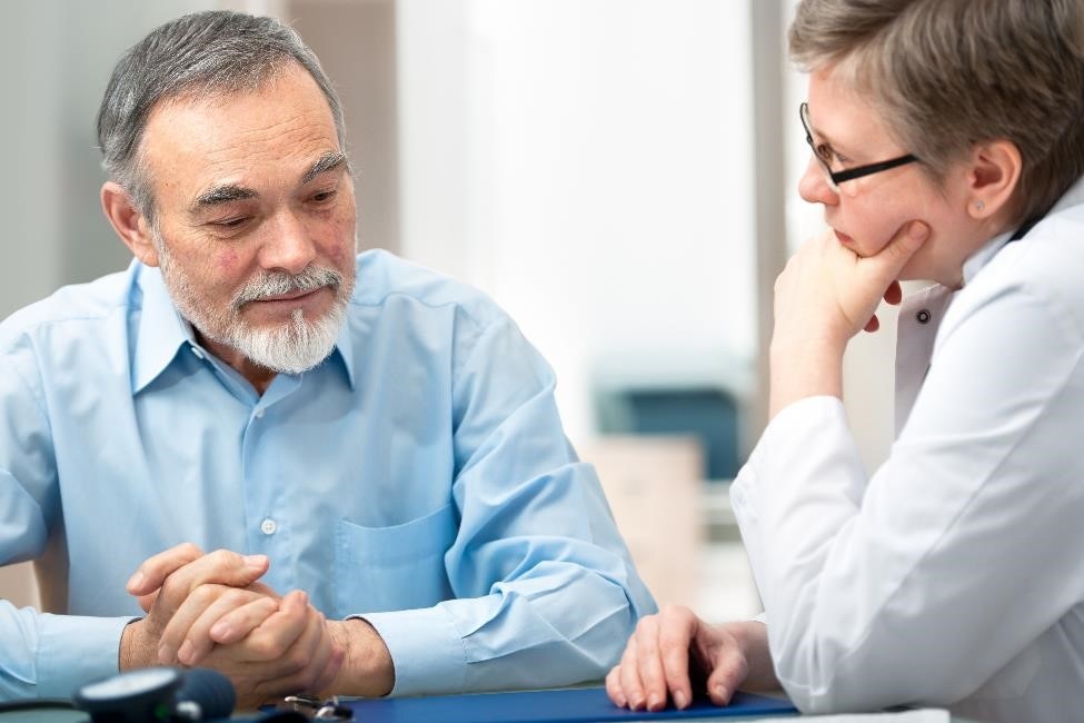 A patient talking with a health care professional.