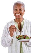 Old woman eating salad