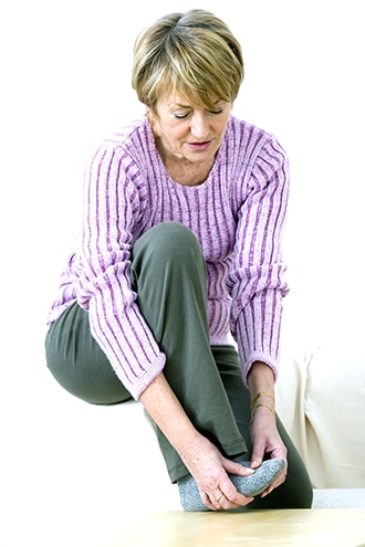 Woman massaging her foot.