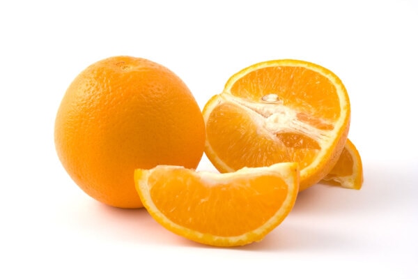 Oranges and orange slices on a white background