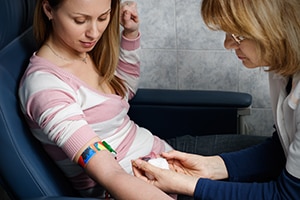 Image of a nurse taking blood