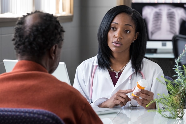 Doctor talking with a patient about a medicine.