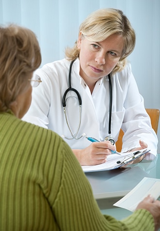 A patient answering a doctor’s questions.