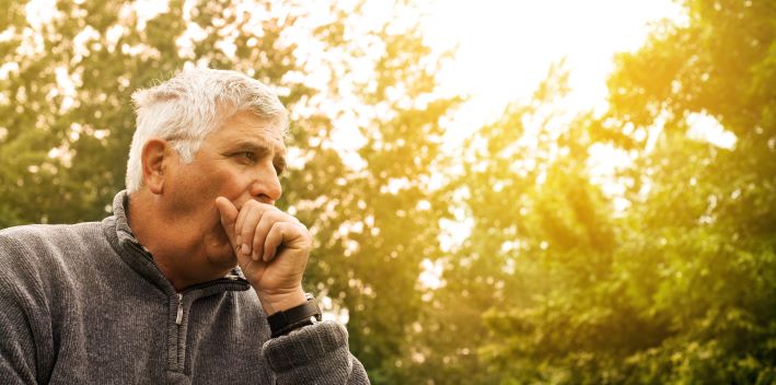 A man coughing.